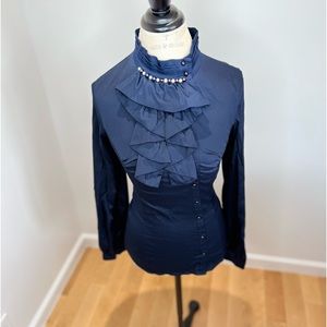 Navy top adjourn with crystals. Front buttons.